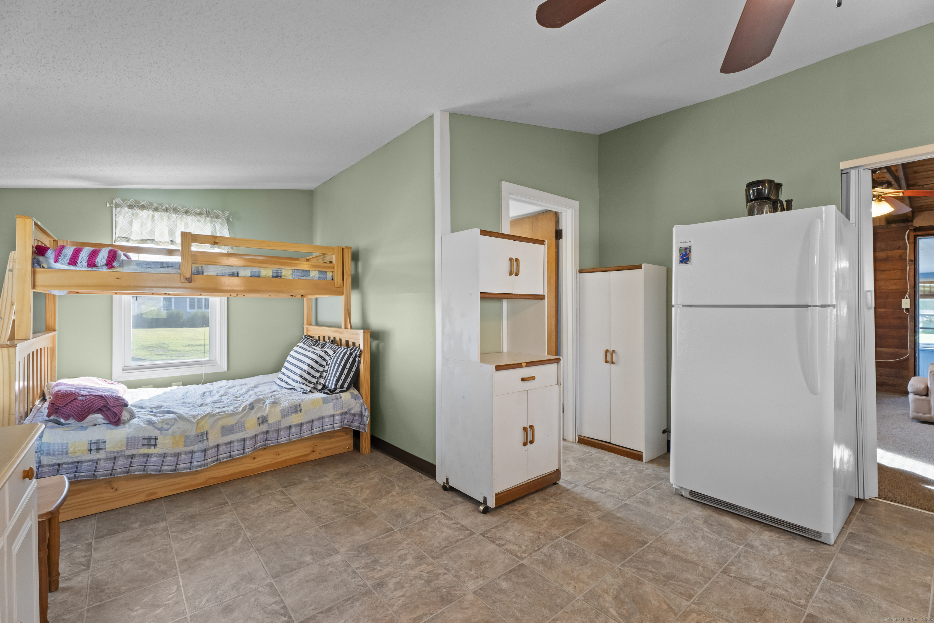 13 College Street Old Saybrook, CT 06475 - Photo 4 of 23 a bedroom with furniture and a bed