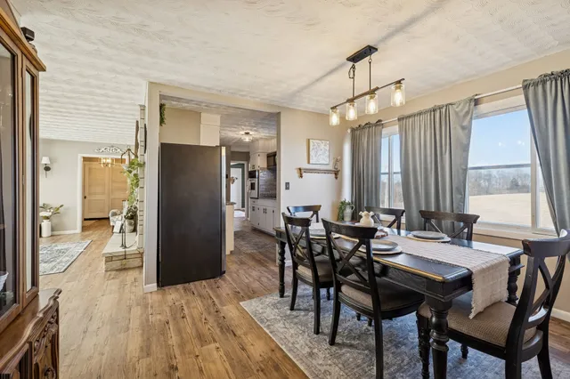 a view of a dining room with furniture window and outside view
