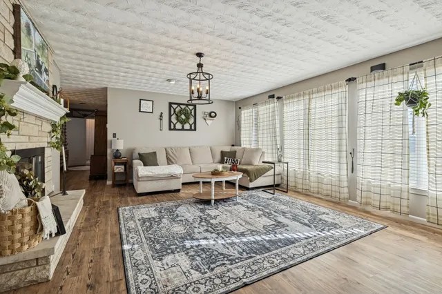 a living room with furniture and a rug