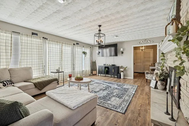 a living room with furniture and a rug