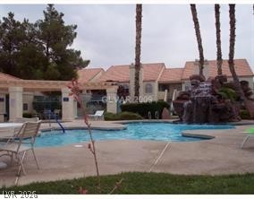 7570 West Flamingo Road, Unit 125 Las Vegas, NV 89147 - Photo 26 of 29 Community pool featuring a patio area