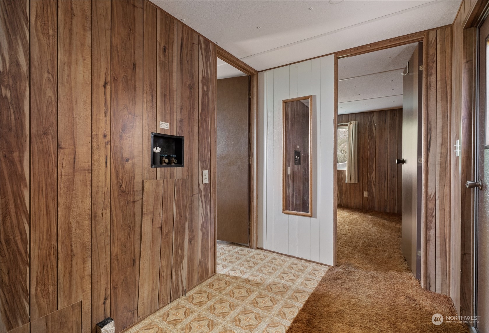4768 Sharpe Road Anacortes, WA 98221 - Photo 12 of 37 a view of a hallway with wooden floor