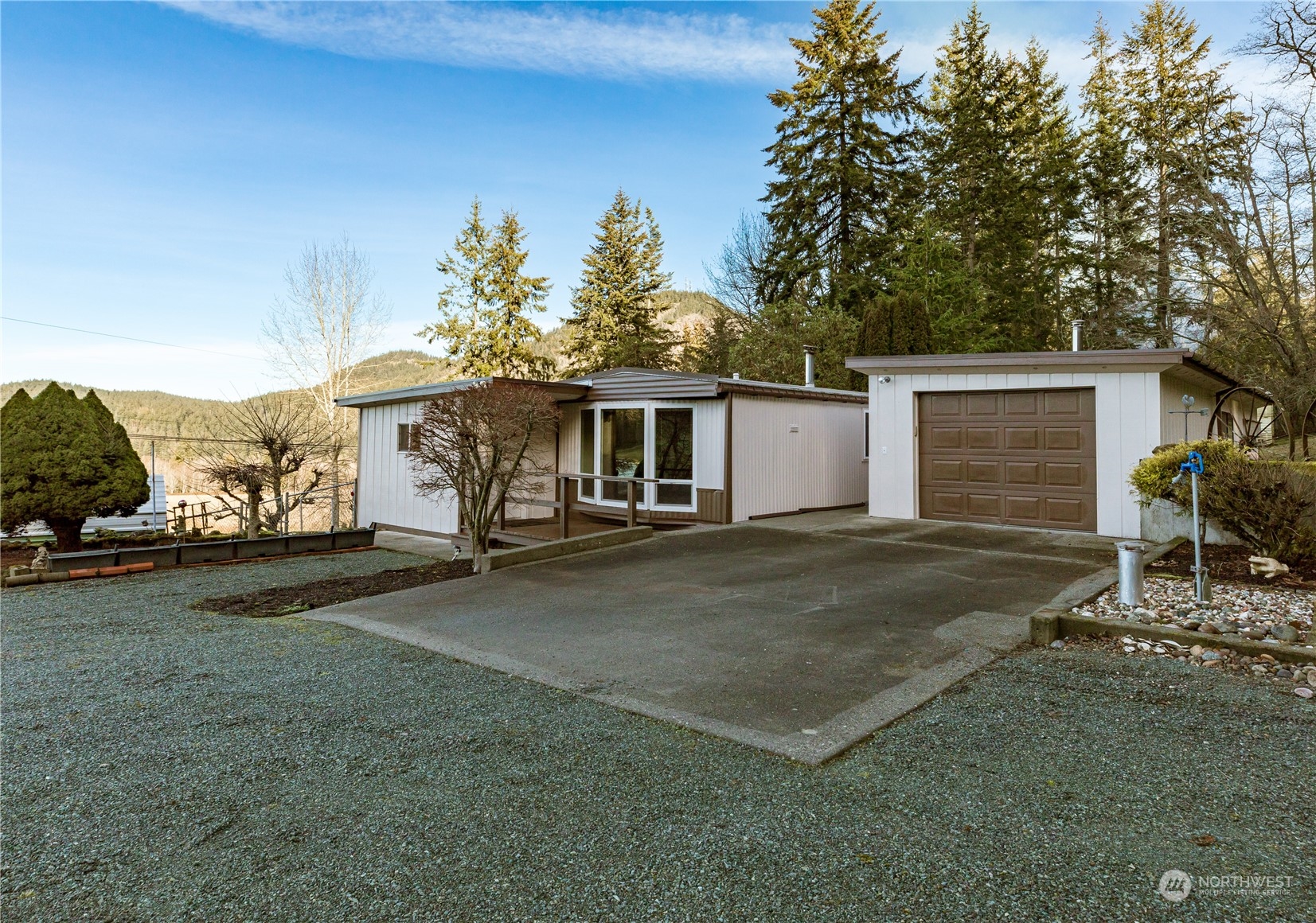 4768 Sharpe Road Anacortes, WA 98221 - Photo 20 of 37 a front view of a house with garden