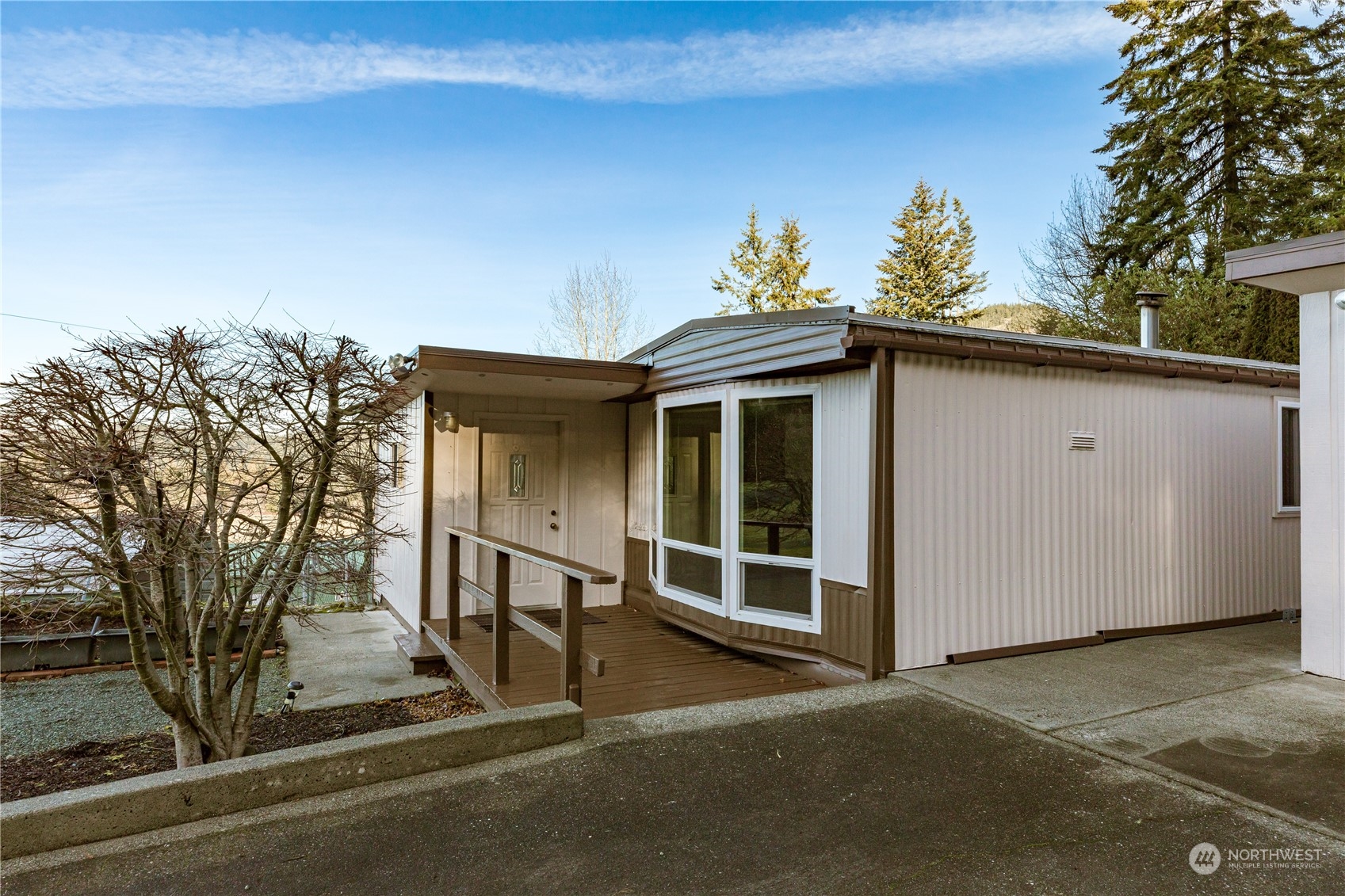 4768 Sharpe Road Anacortes, WA 98221 - Photo 2 of 37 a view of a house with a window and plants