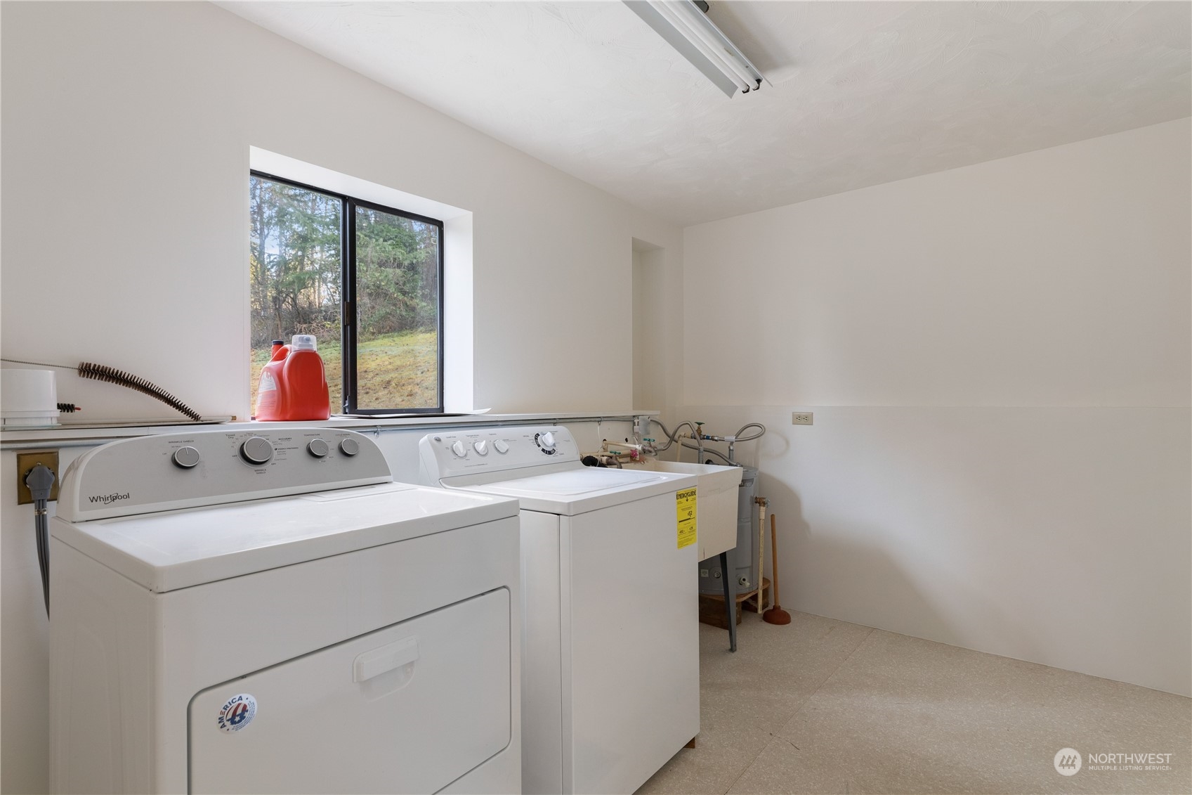 4768 Sharpe Road Anacortes, WA 98221 - Photo 22 of 37 a view of storage and utility room with washer and dryer