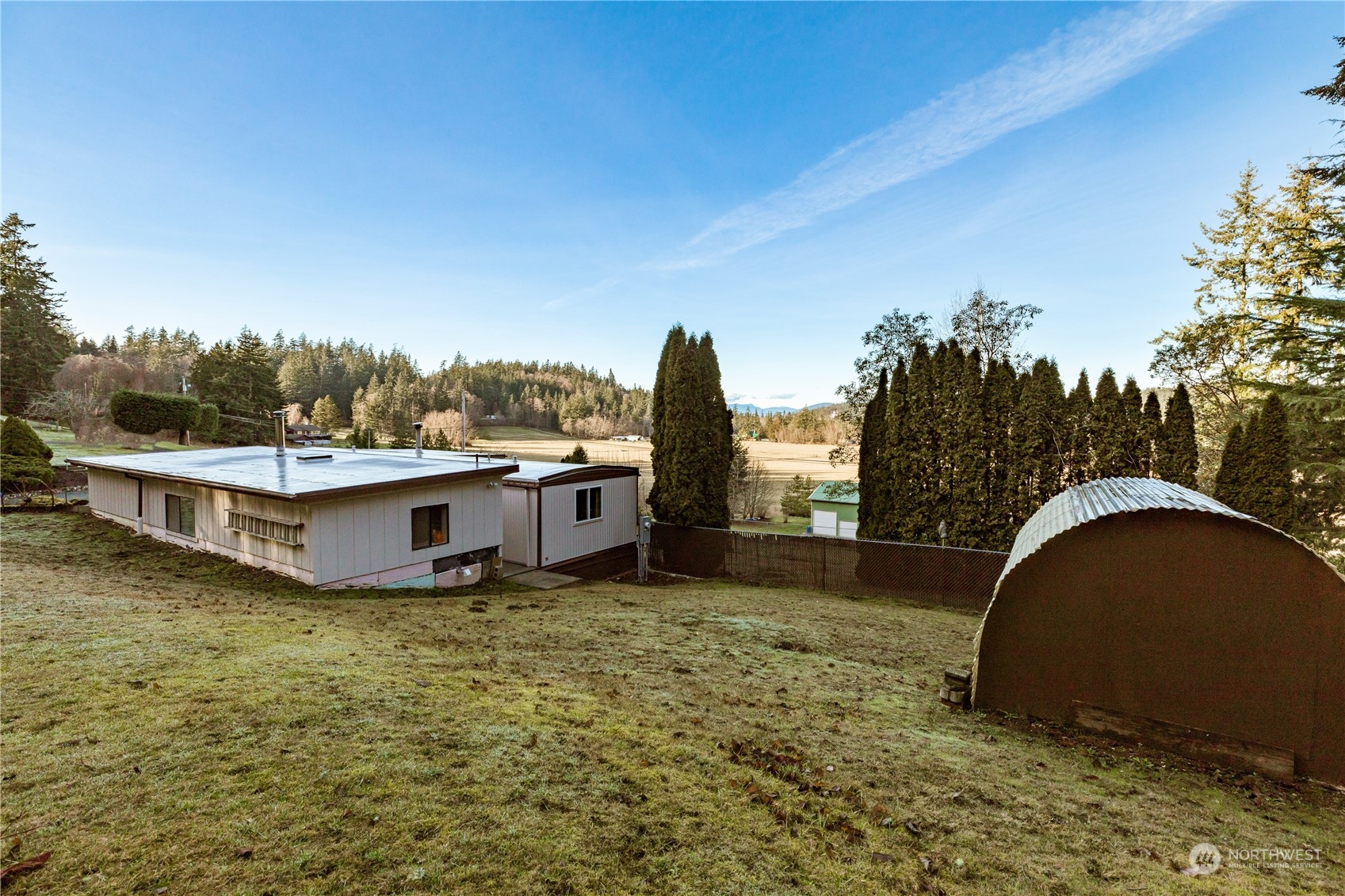 4768 Sharpe Road Anacortes, WA 98221 - Photo 30 of 37 a view of a wooden deck with a yard