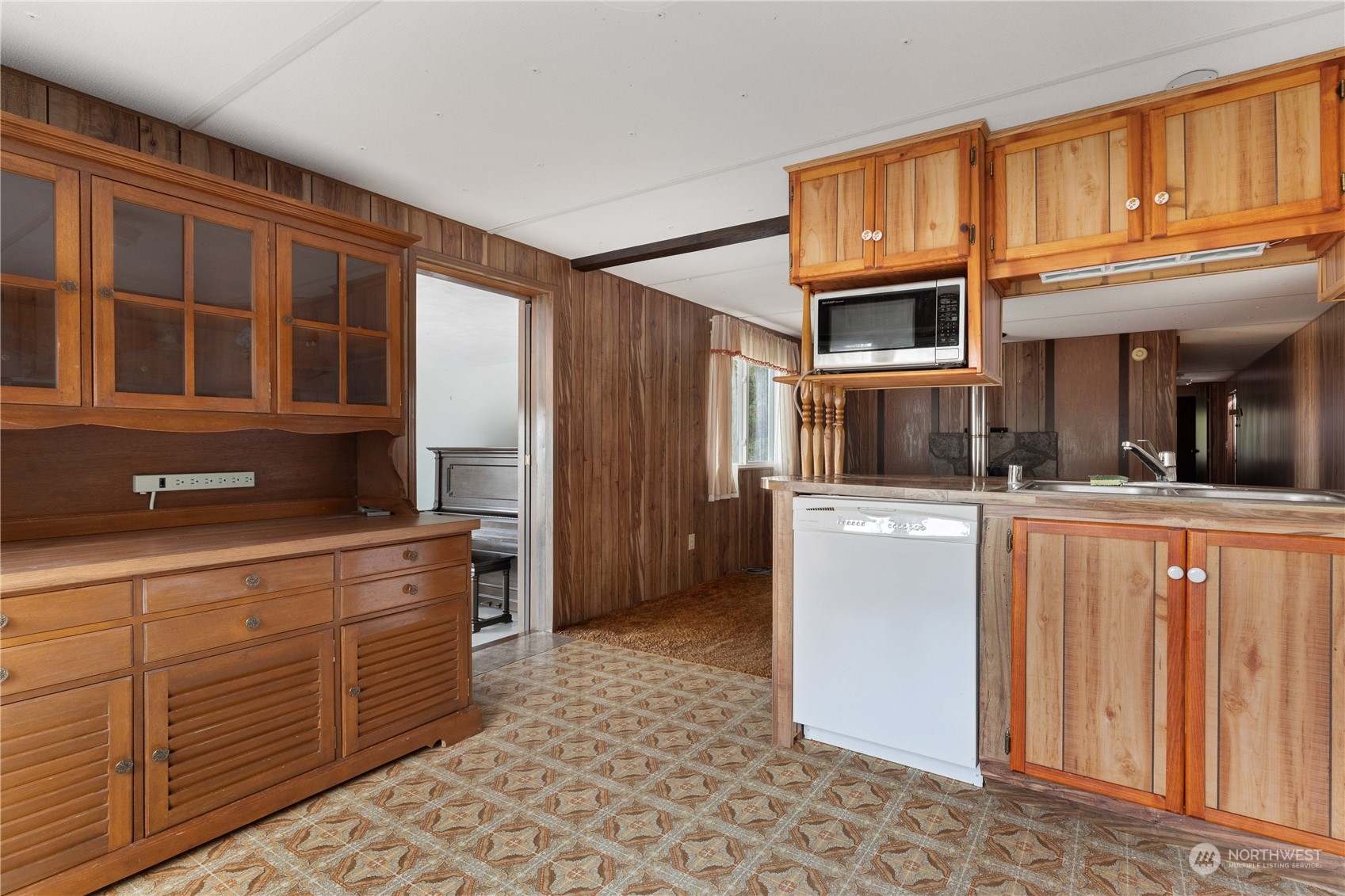 4768 Sharpe Road Anacortes, WA 98221 - Photo 6 of 37 a kitchen with stainless steel appliances granite countertop a refrigerator a stove and a sink with cabinets