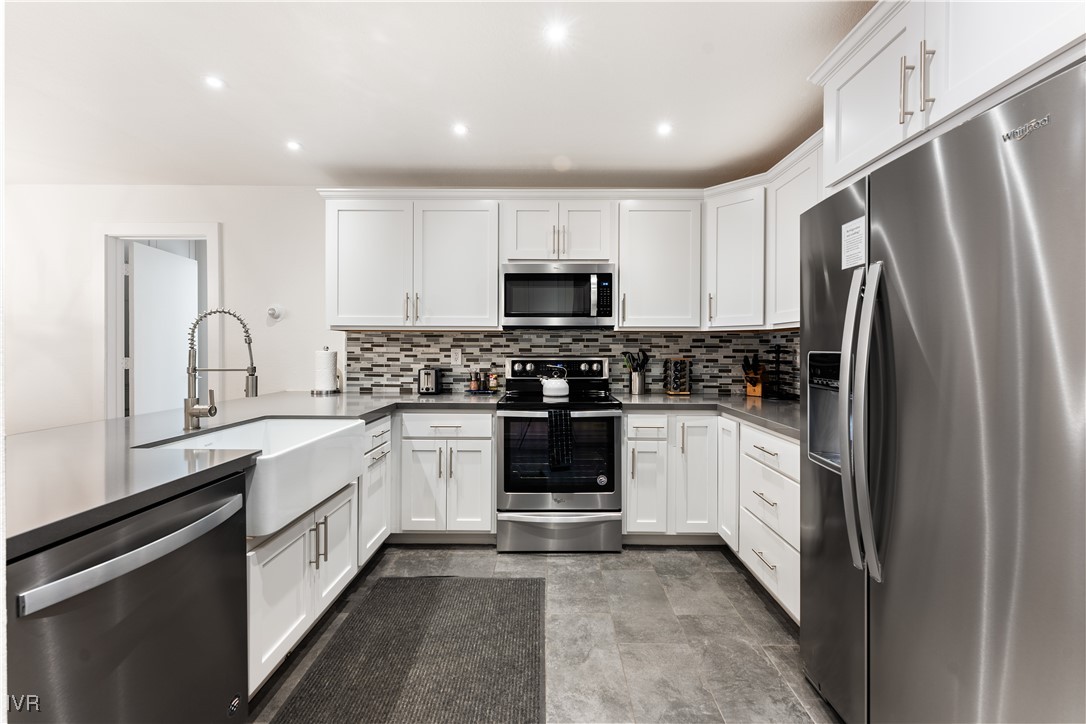 929 Southwood Boulevard, Unit 23 Incline Village, NV 89451 - Photo 10 of 22 a kitchen with a refrigerator and a stove top oven