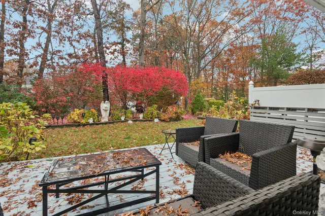 a view of a backyard with sitting area
