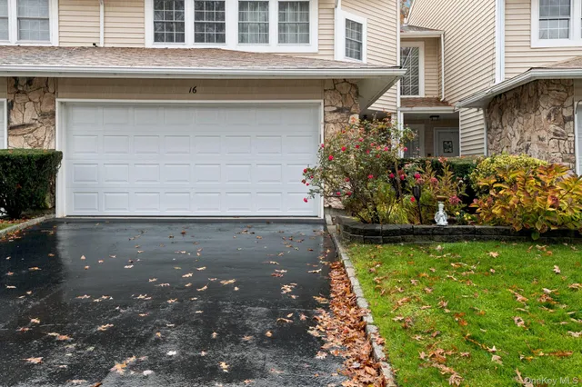 a view of a house with potted plants