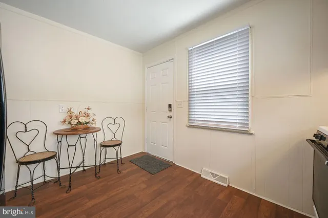 a view of a room that has a table and chair