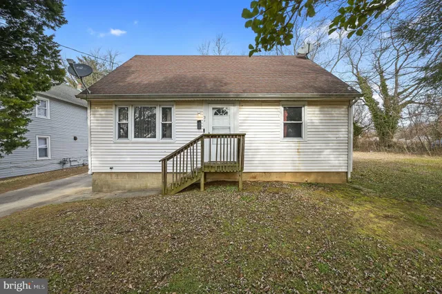 a house with trees in the background