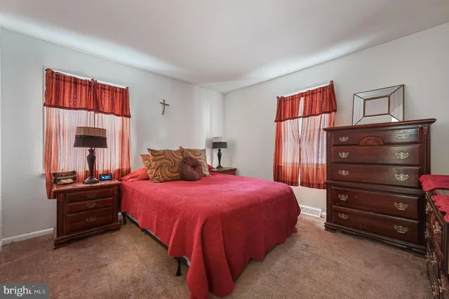 a bedroom with a bed and dresser
