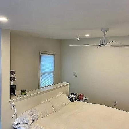 144 Brooks Street Boston, MA 02128 - Photo 16 of 20 a bedroom with a bed and a window