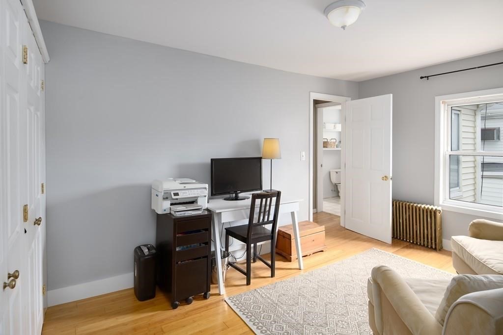 144 Brooks Street Boston, MA 02128 - Photo 10 of 20 a view of a livingroom with workspace and a window