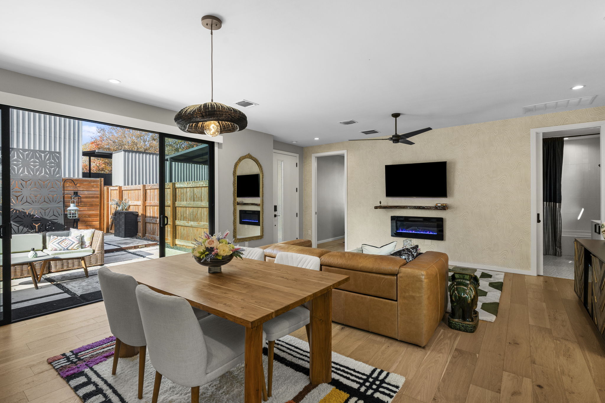 7525 Delafield Lane, Unit B Austin, TX 78752 - Photo 14 of 37 a living room with furniture a flat screen tv and a dining table