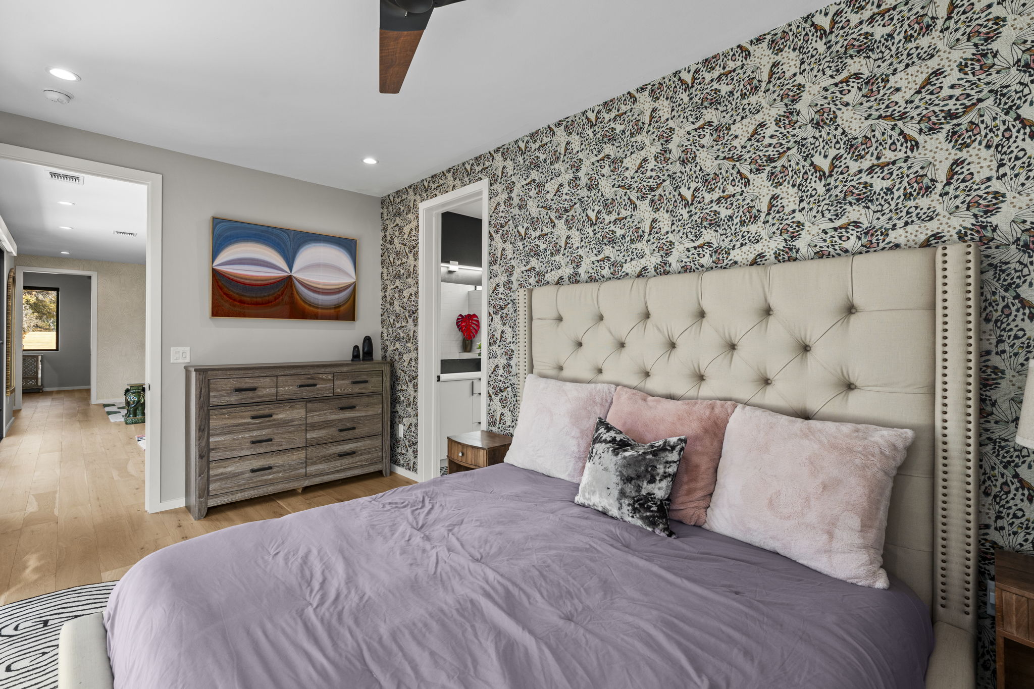 7525 Delafield Lane, Unit B Austin, TX 78752 - Photo 16 of 37 a bedroom with a bed and a walk in closet