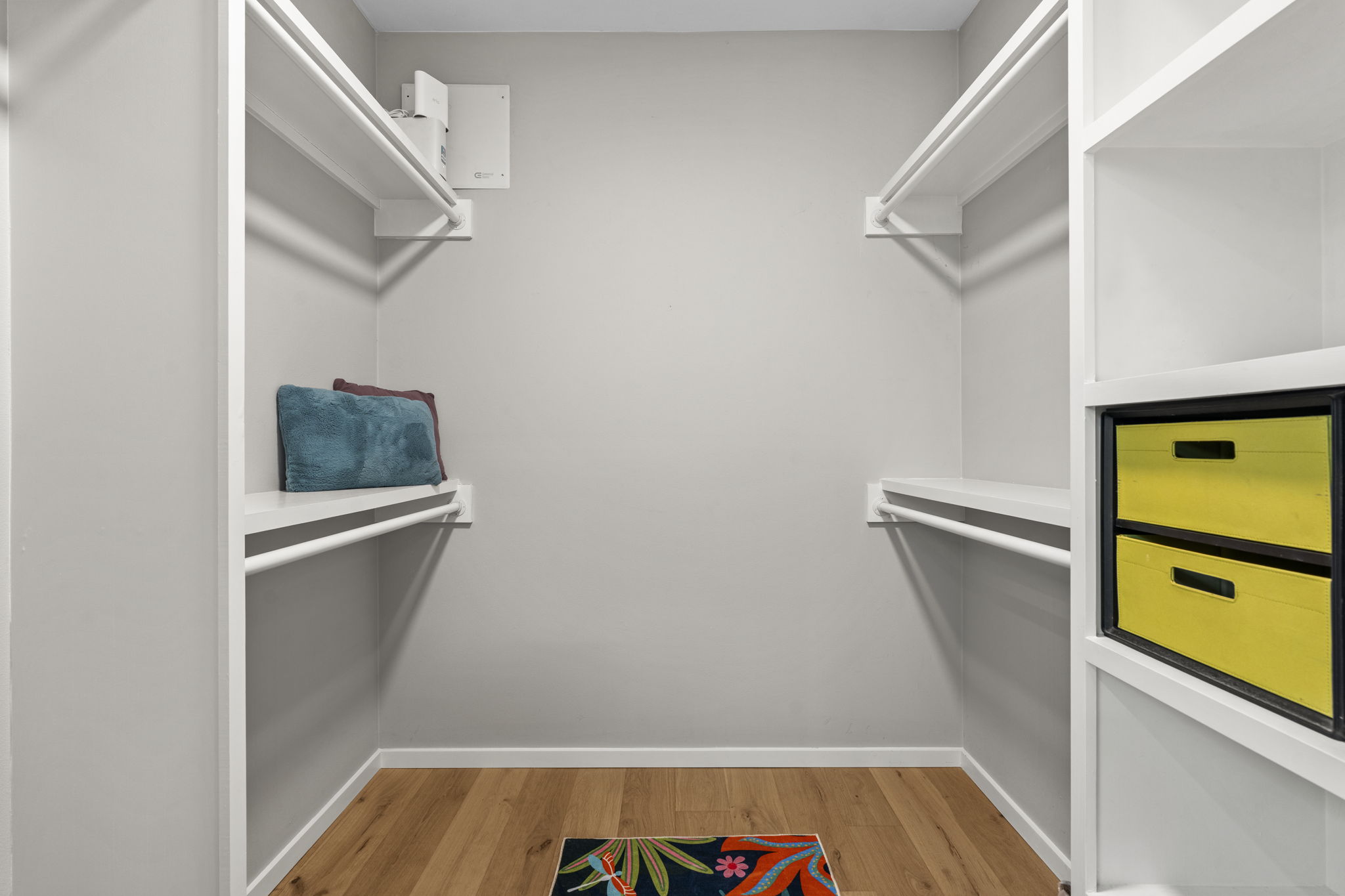 7525 Delafield Lane, Unit B Austin, TX 78752 - Photo 20 of 37 a view of walk in closet with empty space and wooden floor