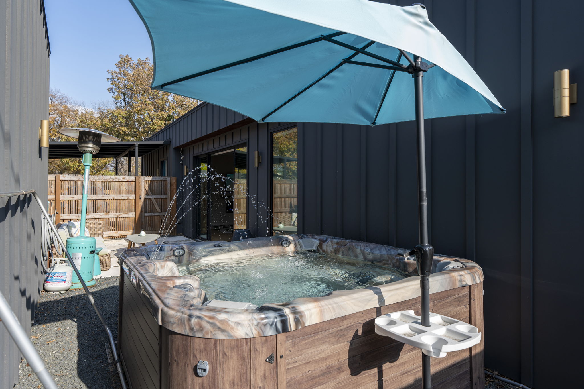 7525 Delafield Lane, Unit B Austin, TX 78752 - Photo 23 of 37 a living room with furniture and a wooden floor