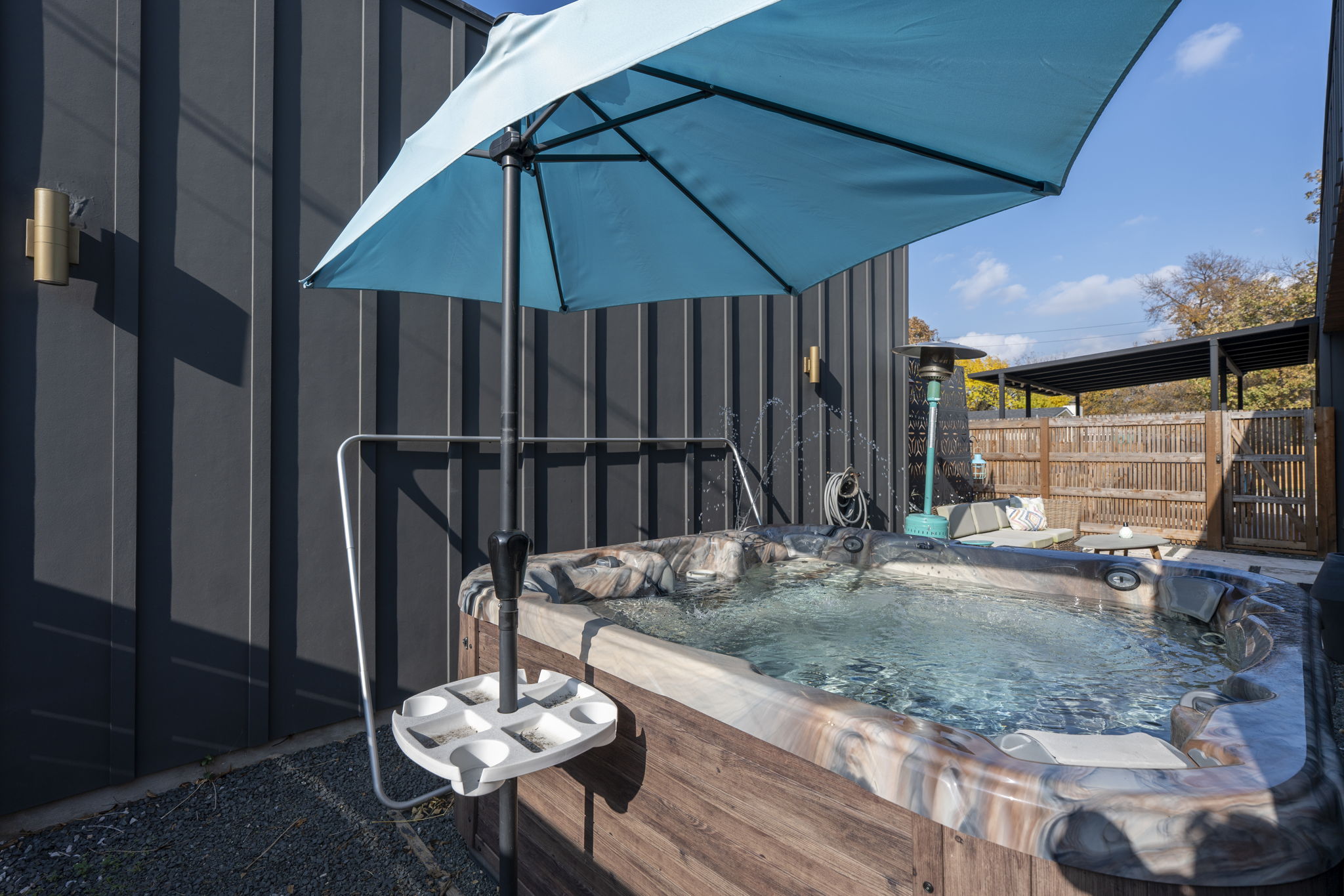 7525 Delafield Lane, Unit B Austin, TX 78752 - Photo 25 of 37 a table and chairs in patio