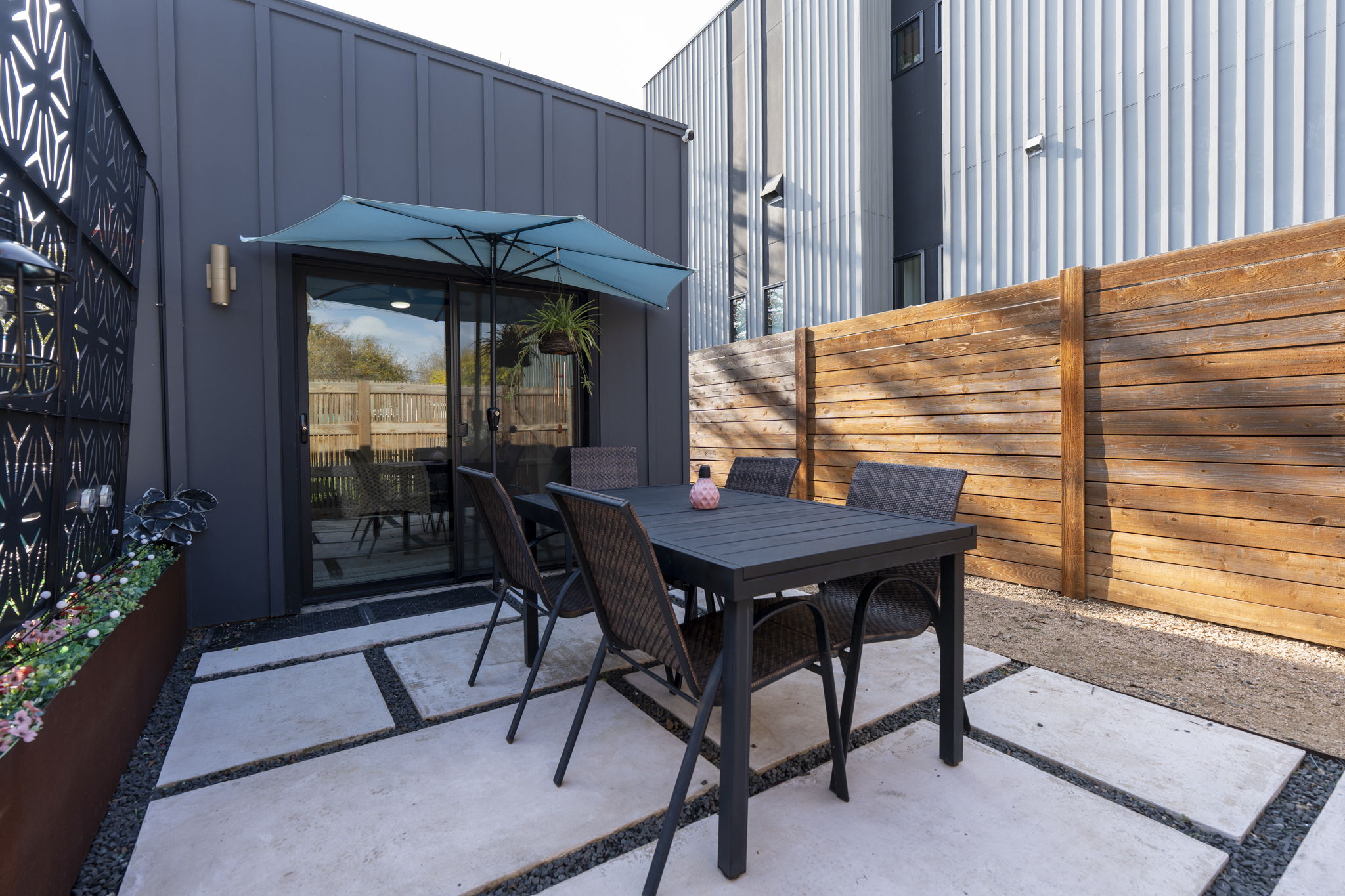 7525 Delafield Lane, Unit B Austin, TX 78752 - Photo 30 of 37 a table and chairs in front of a house