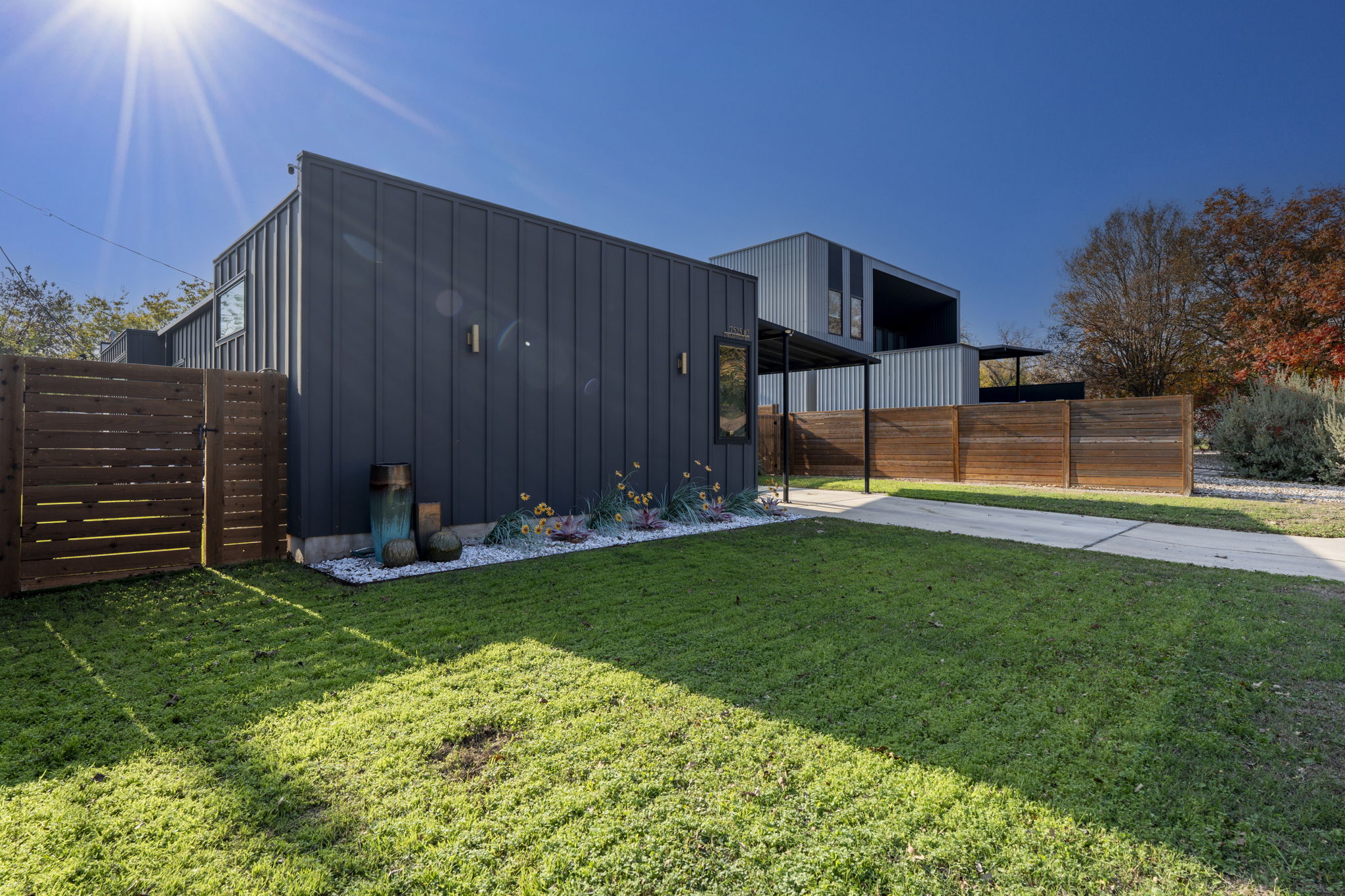 7525 Delafield Lane, Unit B Austin, TX 78752 - Photo 3 of 37 a view of a backyard with sitting area
