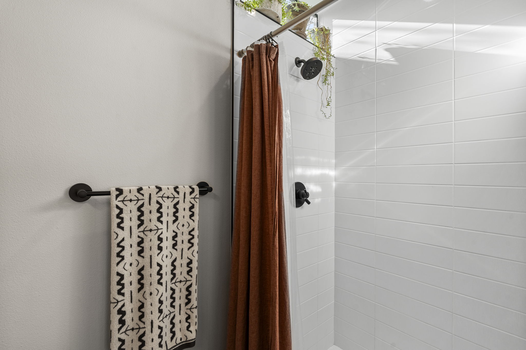 7525 Delafield Lane, Unit B Austin, TX 78752 - Photo 35 of 37 a bathroom with a shower and a glass door