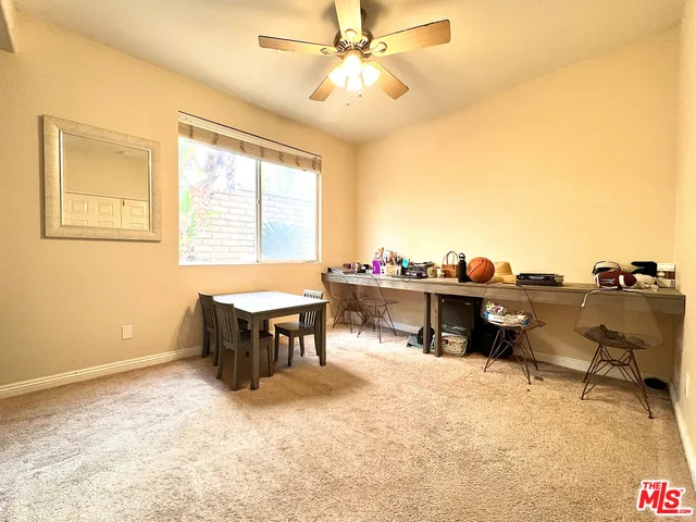 a bedroom with bed and a window