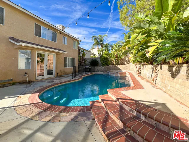 a view of a house with swimming pool