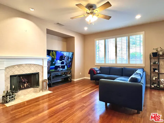 a living room with furniture and kitchen view