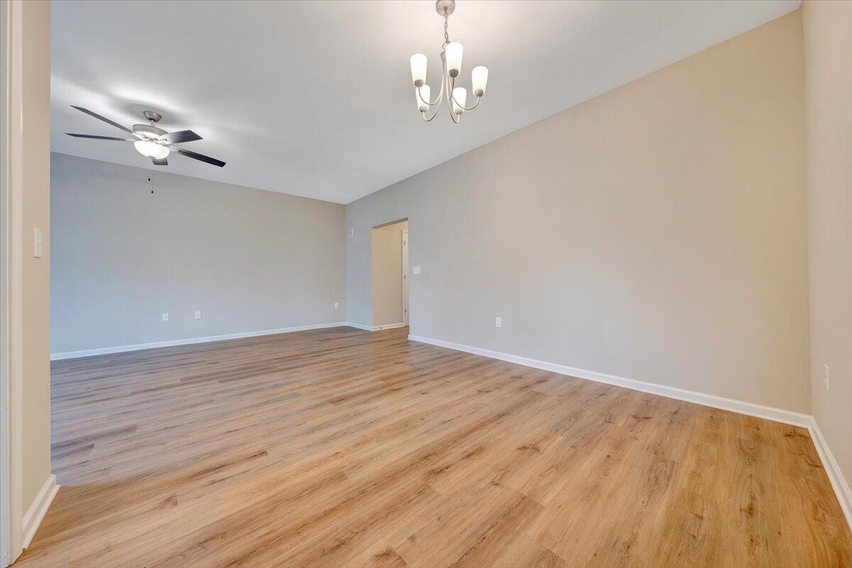 5647 Huntridge Road Roanoke, VA 24019 - Photo 9 of 19 a view of empty room with wooden floor and ceiling fan