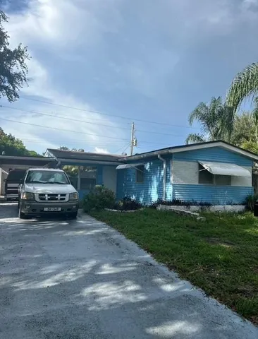 a view of a car in front of a house