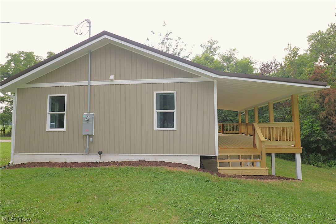 5236 Zenobia Road Wakeman, OH 44889 - Photo 23 of 31 Expansive covered porch featuring natural wood decking and railings