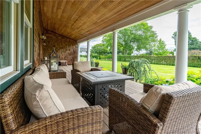 a view of a patio with couches chairs dining table and chairs