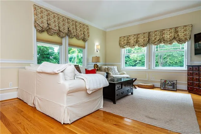 a bed room with a bed and a chair