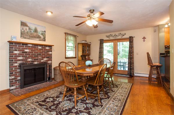 327 Sterling Road Holden, MA 01522 - Photo 7 of 30 a dining room with furniture a fireplace and wooden floor