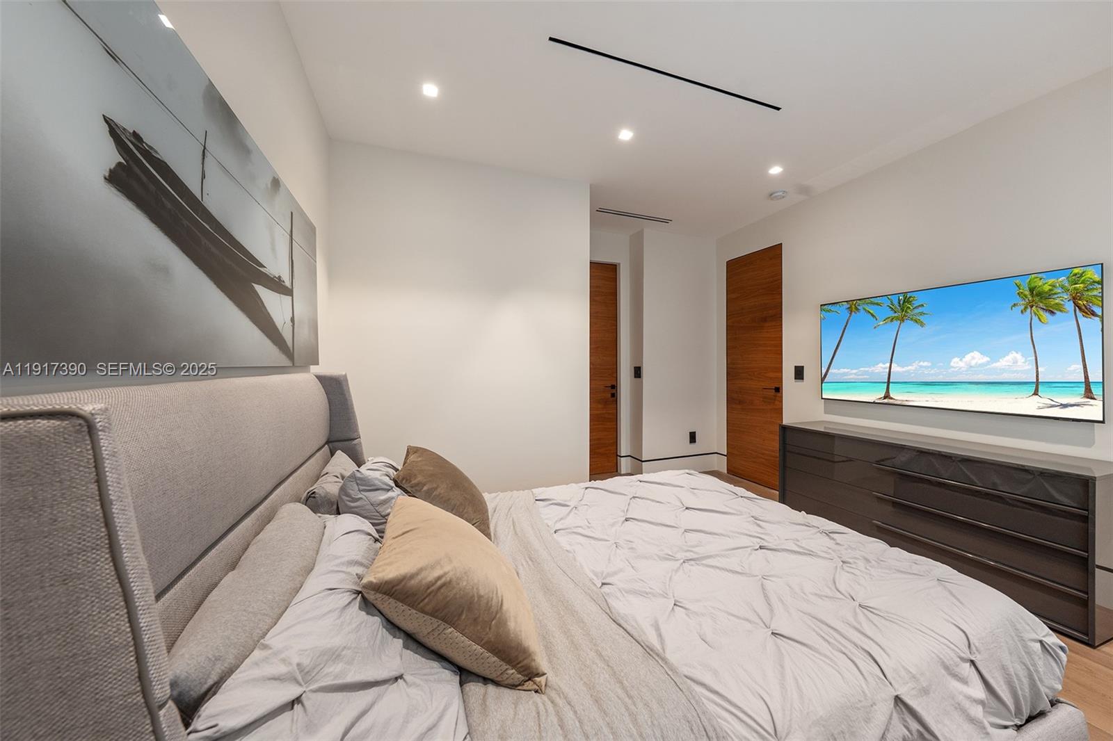 900 Washington Street Hollywood, FL 33019 - Photo 21 of 61 a bedroom with a bed and a large window