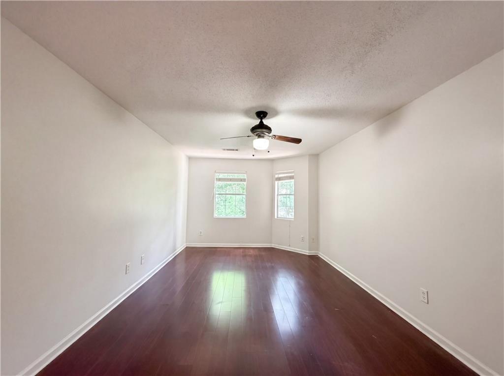 3753 Soapstone Road Decatur, GA 30034 - Photo 13 of 26 wooden floor in an empty room with a window