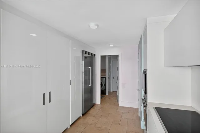 a room with furniture and large windows