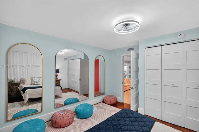 a bathroom with a granite countertop sink a toilet and a mirror