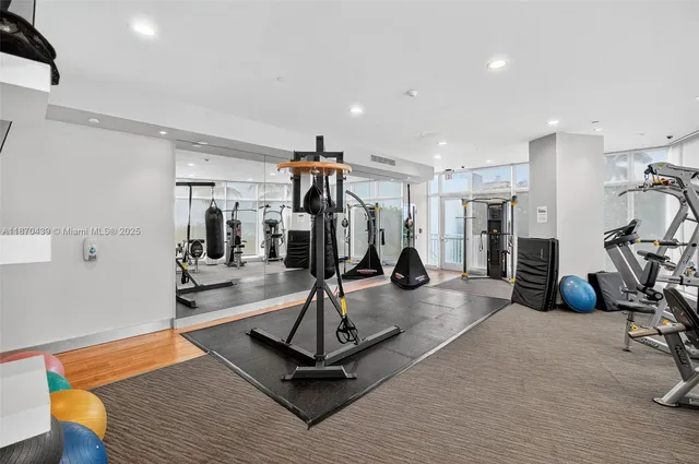 a living room with furniture and chandelier