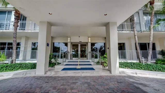 a view of a backyard with plants and entertaining space