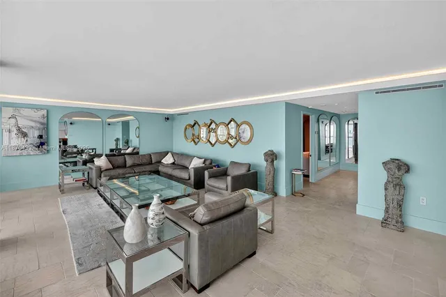 a dining hall with stainless steel appliances a dining table and chairs with wooden floor