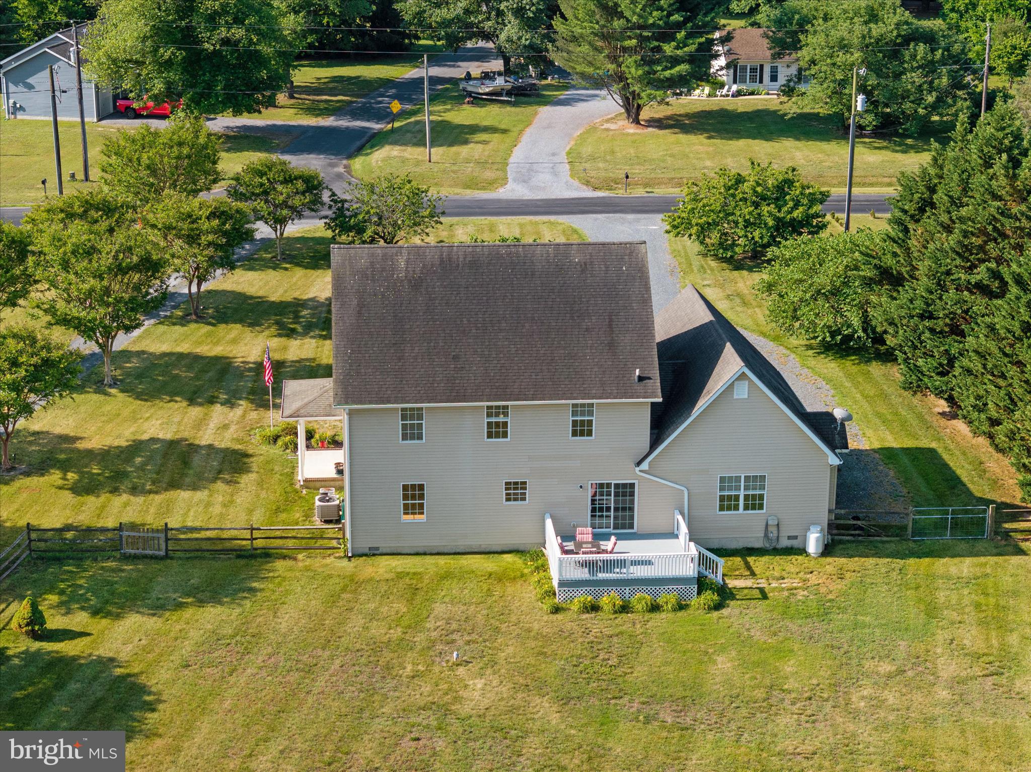 913 Clark Corner Road Centreville, MD 21617 - Photo 43 of 66 a aerial view of a house with swimming pool and a yard