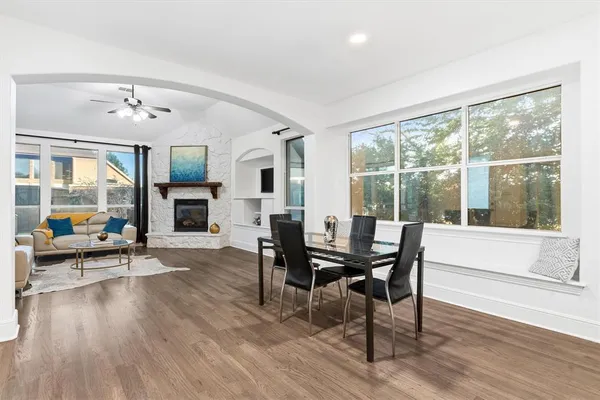 a view of a livingroom with furniture window and wooden floor