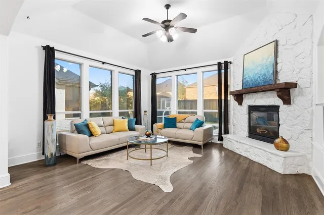 a living room with furniture and a fireplace