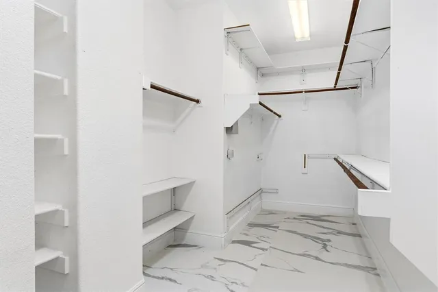 a view of an empty walk in closet