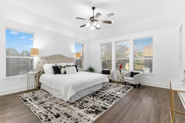 a bedroom with a large bed and a window