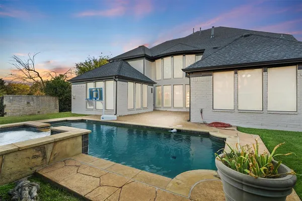 a view of a house with pool table and chairs
