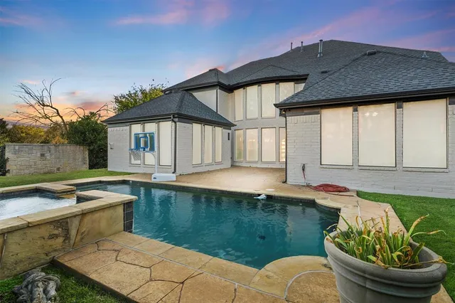 a view of a house with pool table and chairs